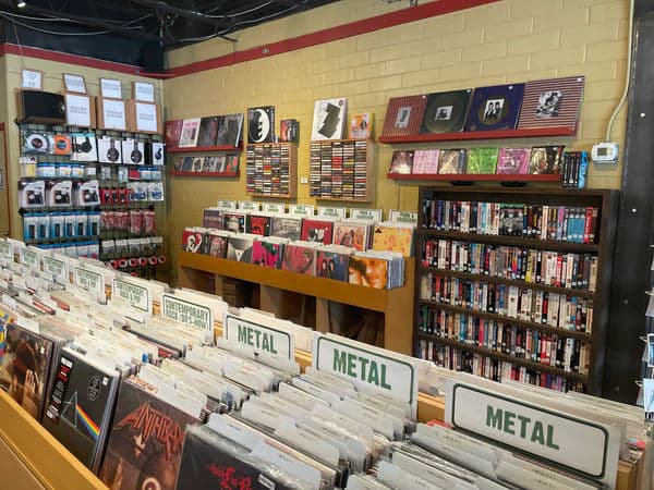 Interior of Breakaway Records, with rows of vinyl organized by genre, including a Metal section in the foreground.