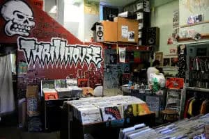 Punk-centric SF shop with graffiti Thrillhouse mural, flyers and posters, and bins of used punk/hardcore LPs.