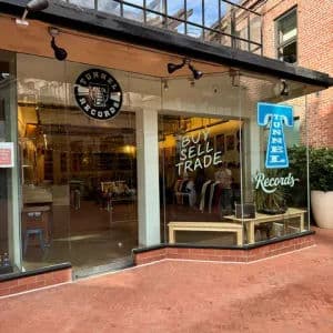 Record bins and wall displays inside Tunnel Records in San Francisco, a neighborhood shop with neatly organized sections and a relaxed, local feel.